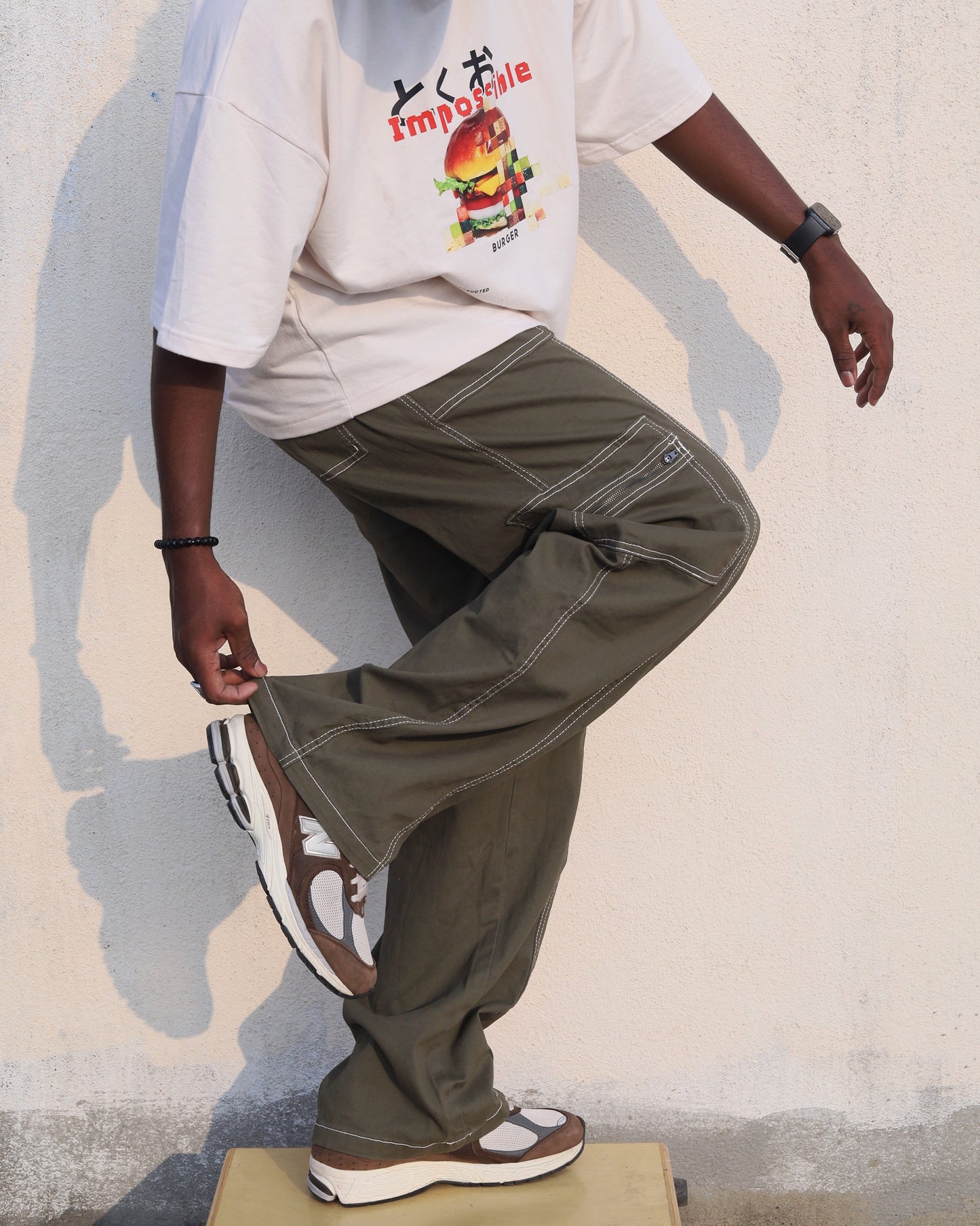 Green cargos with white stitch details